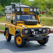 A yellow-colored Defender camel trophy in 1:24 scale range.