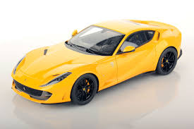MAISTO 1:64 FERRARI SUPERFAST model car in yellow color.