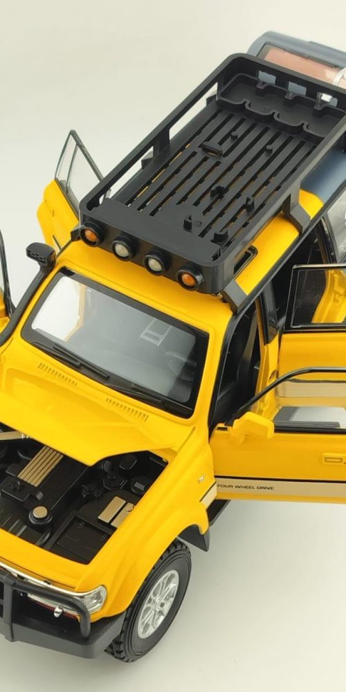 Die cast model yellow land cruiser box piece image in a open format.